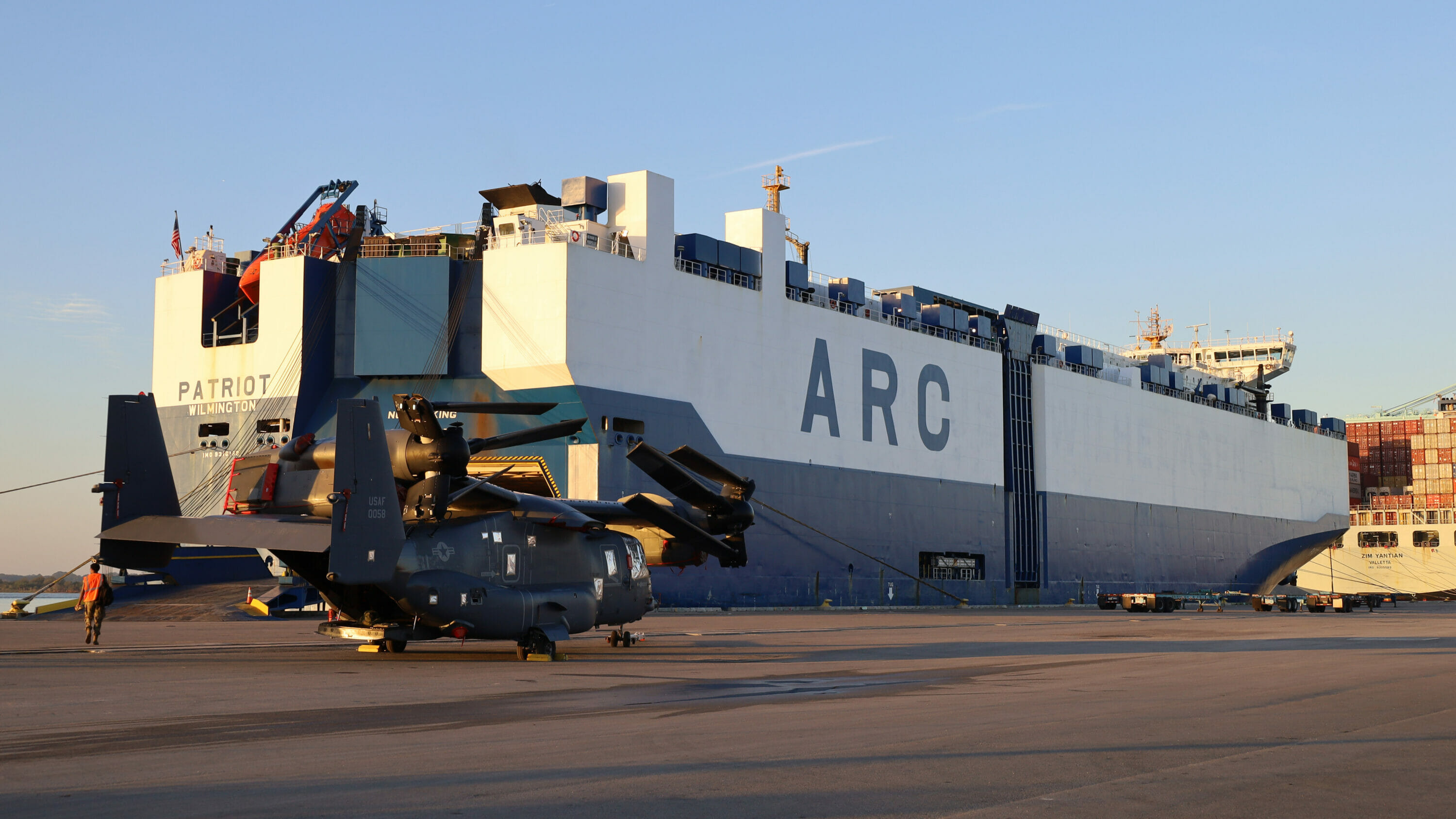 ARC Ship at port loading a Military Helicopter