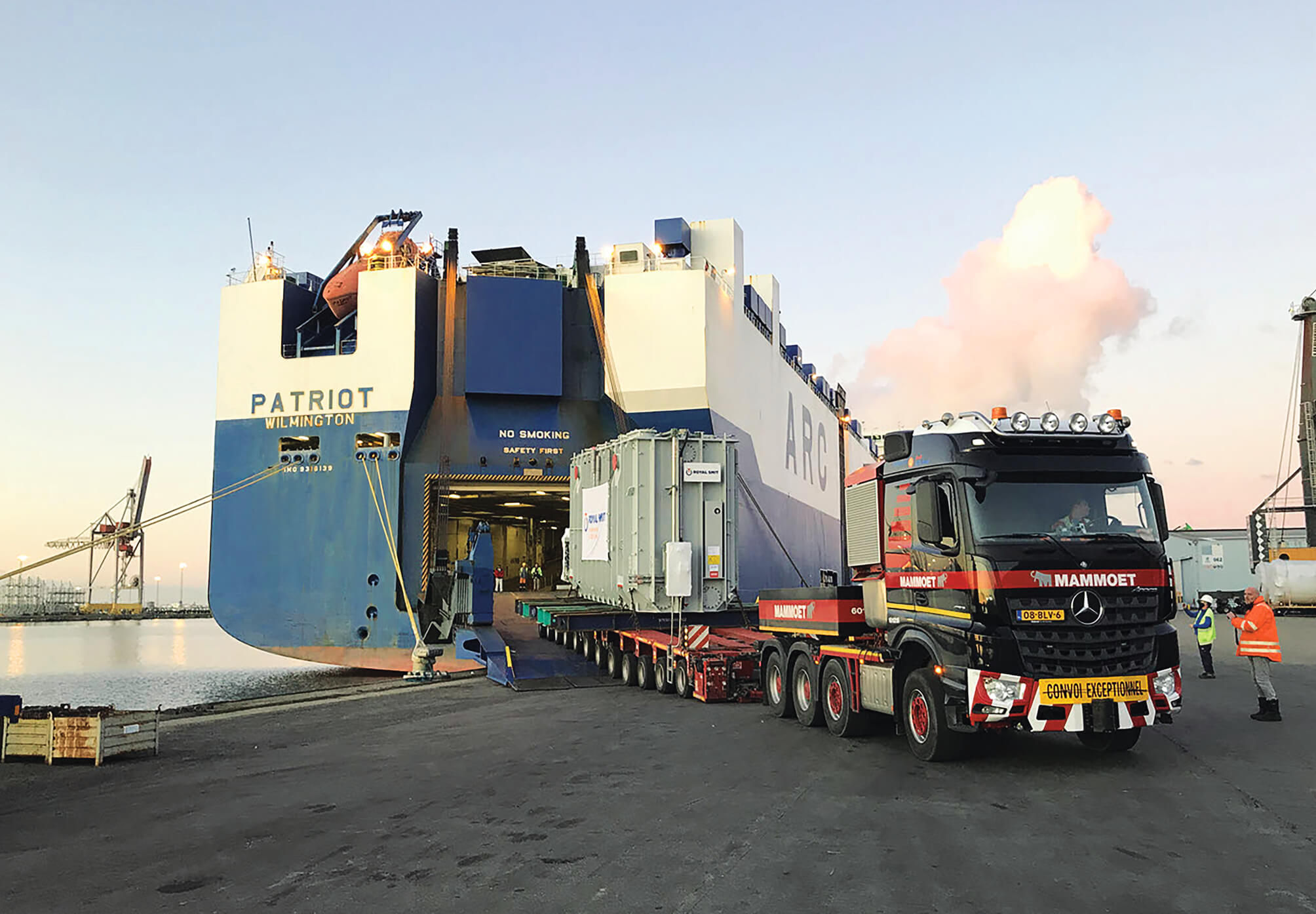 Truck Loading Large Transformers onto an ARC Ship